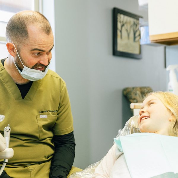 Dr. James Stirland with his patient happily smiling and having fun